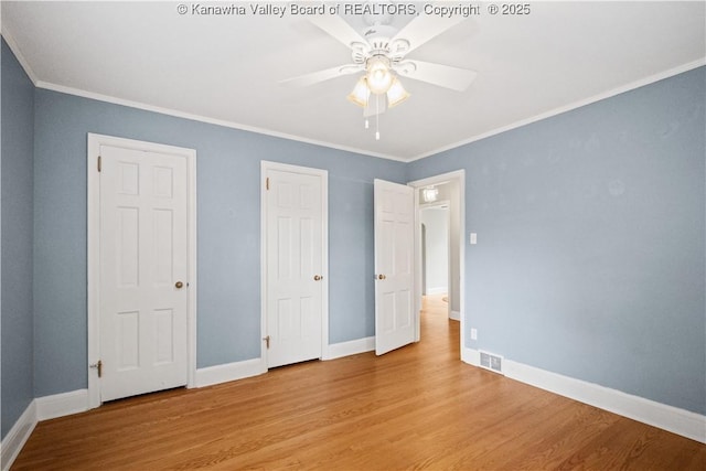 102 49th St SE, Charleston, WV 25304 - unfurnished bedroom featuring wood finished floors, ornamental molding, baseboards, and a ceiling fan