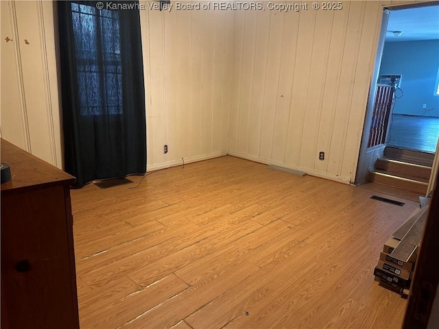 5106 Staunton Ave SE, Charleston, WV 25304 - unfurnished dining area with light wood-style flooring and baseboards
