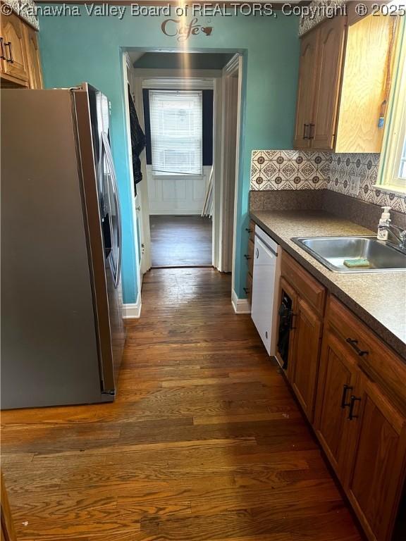 5106 Staunton Ave SE, Charleston, WV 25304 - kitchen with stainless steel fridge with ice dispenser, a sink, white dishwasher, dark wood-style floors, and decorative backsplash