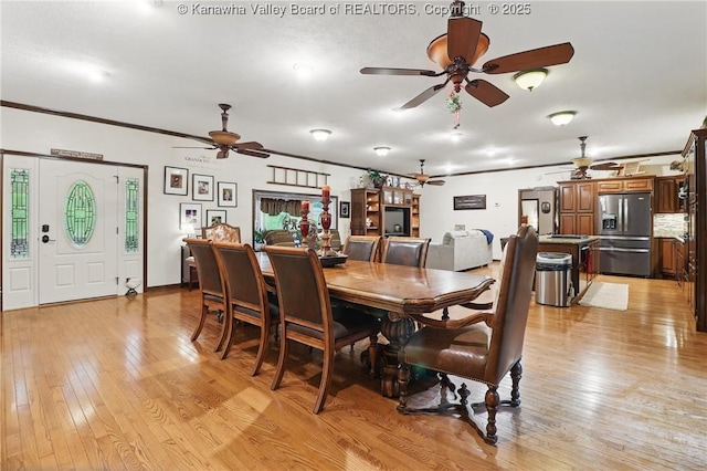 3282 Greenview Rd, South Charleston, WV 25303 - dining room with ceiling fan, light wood-style floors, and crown molding