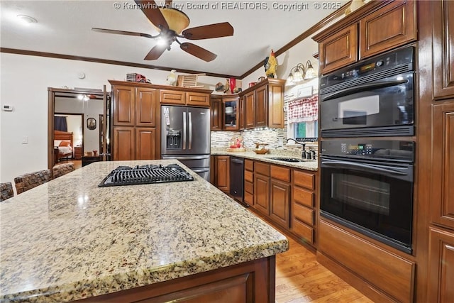 3282 Greenview Rd, South Charleston, WV 25303 - kitchen with black appliances, a sink, crown molding, ceiling fan, and light stone countertops