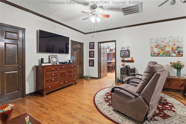 3282 Greenview Rd, South Charleston, WV 25303 - living area with a ceiling fan, ornamental molding, light wood finished floors, and baseboards