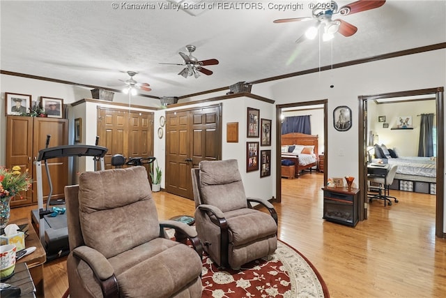 3282 Greenview Rd, South Charleston, WV 25303 - living room with a ceiling fan, ornamental molding, light wood-style floors, and a textured ceiling