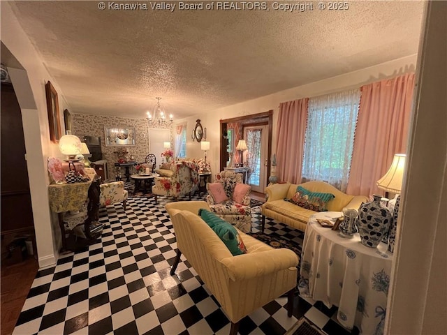 103 Chestnut Dr, Peytona, WV 25154 - living room with a textured ceiling, tile patterned floors, and a chandelier
