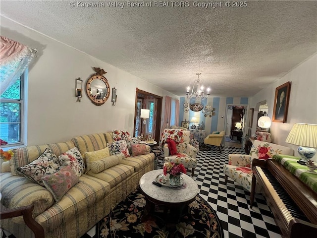 103 Chestnut Dr, Peytona, WV 25154 - living room featuring a chandelier, tile patterned floors, and a textured ceiling