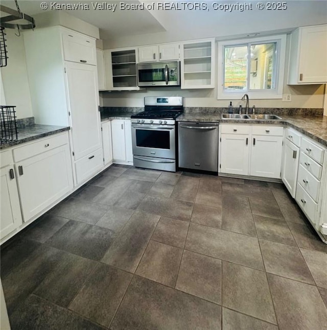 930 Mathews Ave, Charleston, WV 25302 - kitchen featuring appliances with stainless steel finishes, a sink, dark countertops, open shelves, and white cabinets