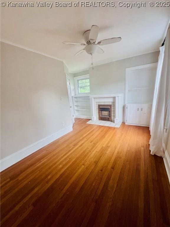 930 Mathews Ave, Charleston, WV 25302 - unfurnished living room featuring hardwood / wood-style floors, a fireplace with flush hearth, baseboards, and ceiling fan