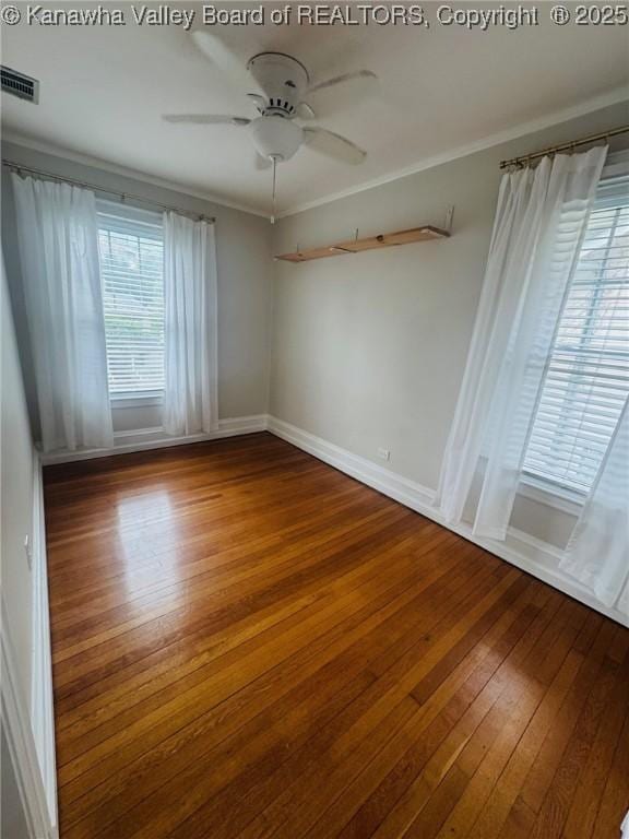 930 Mathews Ave, Charleston, WV 25302 - spare room with wood-type flooring, a ceiling fan, crown molding, and baseboards