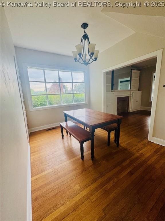 930 Mathews Ave, Charleston, WV 25302 - dining area featuring hardwood / wood-style flooring, a chandelier, baseboards, and a fireplace