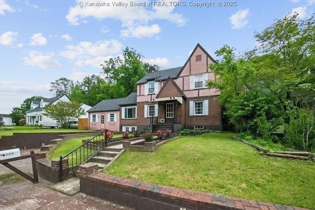 608 Kanawha Ave, Clendenin, WV 25045 - english style home with a front lawn and brick siding