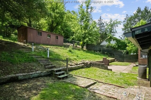 608 Kanawha Ave, Clendenin, WV 25045 - view of yard with an outdoor structure and a shed