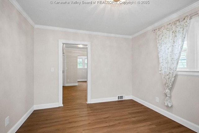 608 Kanawha Ave, Clendenin, WV 25045 - unfurnished room with crown molding, wood finished floors, and baseboards