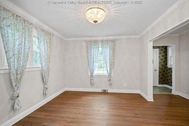 608 Kanawha Ave, Clendenin, WV 25045 - unfurnished room with healthy amount of natural light, wood finished floors, a chandelier, and crown molding