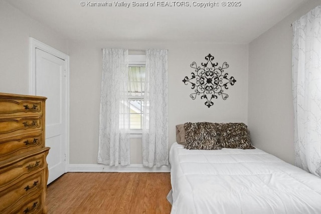 608 Kanawha Ave, Clendenin, WV 25045 - bedroom with wood finished floors and baseboards