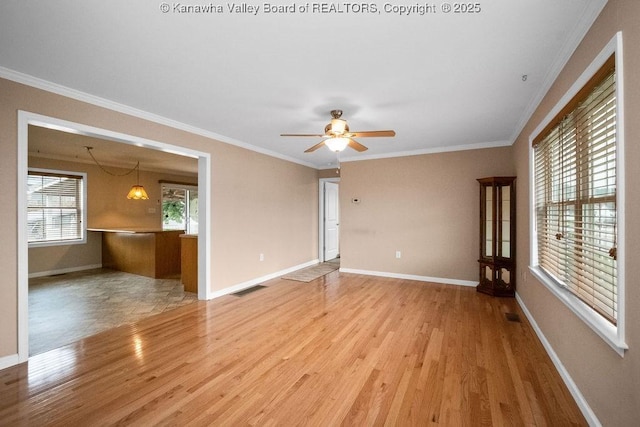 5211 Ohio St, South Charleston, WV 25309 - unfurnished room with wood finished floors, crown molding, baseboards, and a ceiling fan