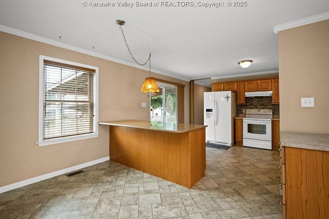 5211 Ohio St, South Charleston, WV 25309 - kitchen with white appliances, under cabinet range hood, brown cabinetry, crown molding, and baseboards
