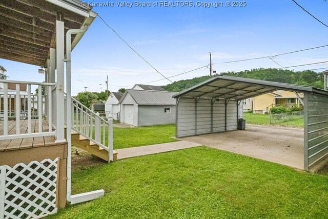 5211 Ohio St, South Charleston, WV 25309 - view of green lawn featuring a detached carport, stairs, and driveway