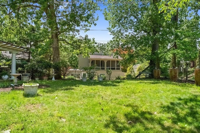 606 Fort Hill Dr, Charleston, WV 25314 - view of grassy yard with a sunroom