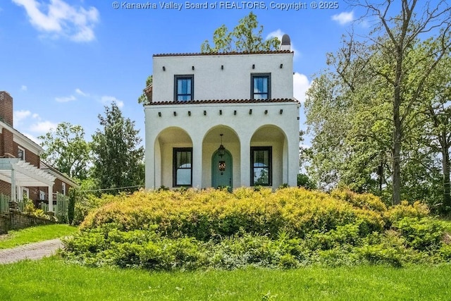 606 Fort Hill Dr, Charleston, WV 25314 - mediterranean / spanish-style house with stucco siding and a chimney