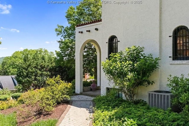 606 Fort Hill Dr, Charleston, WV 25314 - property entrance featuring stucco siding and central AC unit