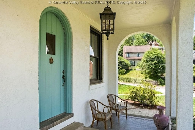 606 Fort Hill Dr, Charleston, WV 25314 - property entrance with stucco siding and covered porch