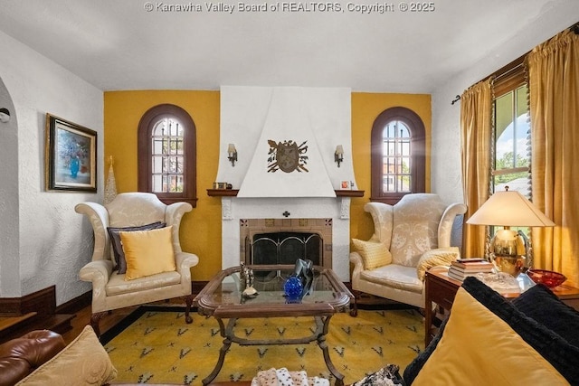 606 Fort Hill Dr, Charleston, WV 25314 - living area with a fireplace and wood finished floors