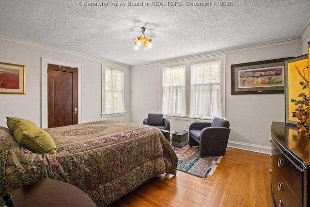 606 Fort Hill Dr, Charleston, WV 25314 - bedroom with ornamental molding, wood finished floors, a textured ceiling, baseboards, and a chandelier