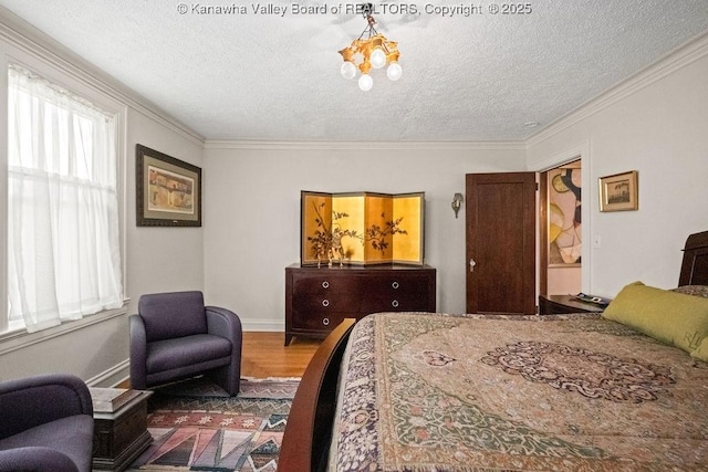 606 Fort Hill Dr, Charleston, WV 25314 - bedroom featuring a textured ceiling, crown molding, wood finished floors, and baseboards
