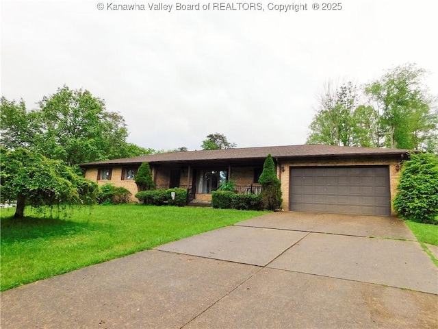 ranch-style home featuring an attached garage, a front lawn, concrete driveway, and brick siding