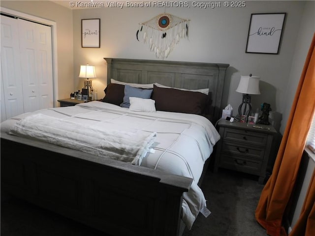 carpeted bedroom featuring a closet