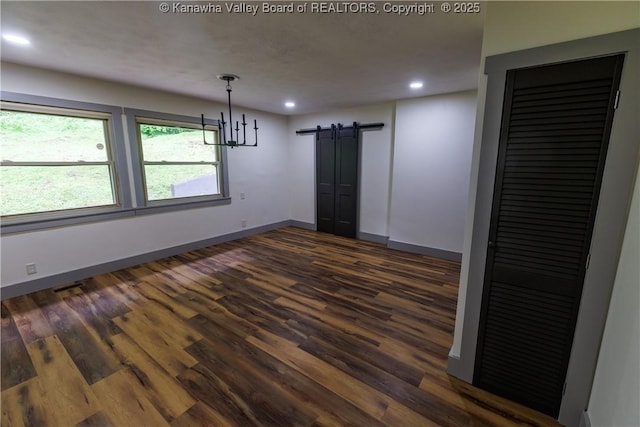 352 Hidden Valley Rd, Chapmanville, WV 25508 - unfurnished dining area with a barn door, dark wood-style floors, recessed lighting, and baseboards