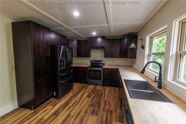 352 Hidden Valley Rd, Chapmanville, WV 25508 - kitchen featuring electric range, black refrigerator with ice dispenser, a sink, wood finished floors, and light countertops