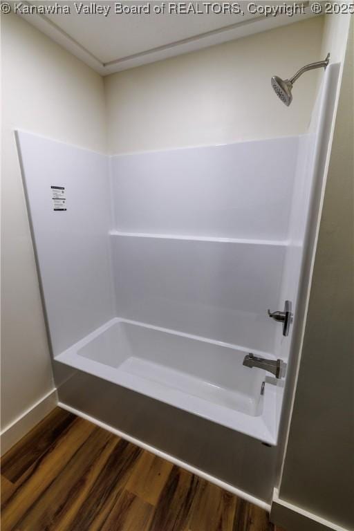 352 Hidden Valley Rd, Chapmanville, WV 25508 - bathroom featuring wood finished floors and shower / tub combination