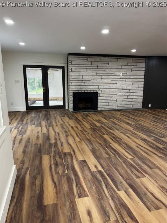 352 Hidden Valley Rd, Chapmanville, WV 25508 - unfurnished living room with wood finished floors, french doors, a fireplace, recessed lighting, and baseboards