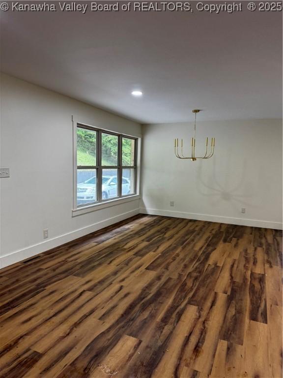 352 Hidden Valley Rd, Chapmanville, WV 25508 - spare room with dark wood-type flooring, baseboards, recessed lighting, and a chandelier
