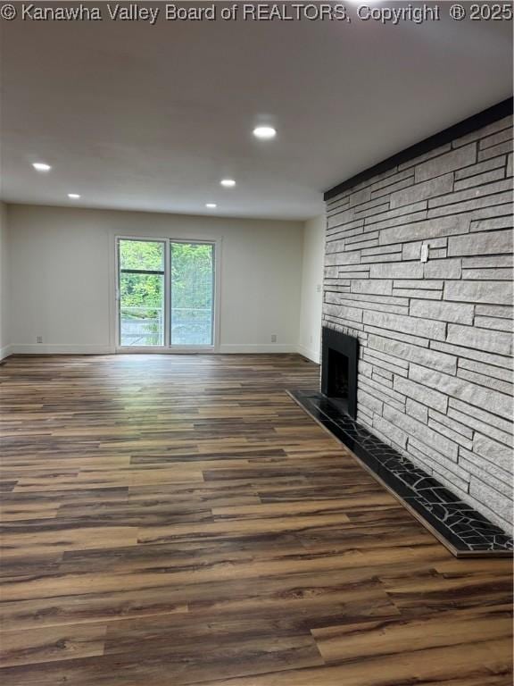 352 Hidden Valley Rd, Chapmanville, WV 25508 - unfurnished living room with baseboards, recessed lighting, a fireplace, and dark wood-style flooring