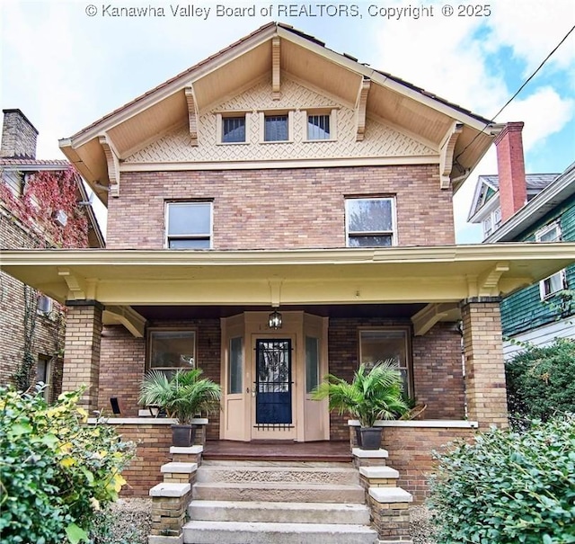 1505 Lee St E, Charleston, WV 25311 - view of front facade with a porch and brick siding