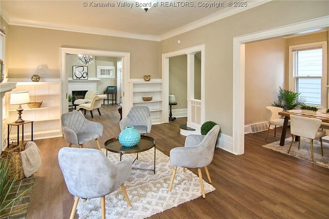1505 Lee St E, Charleston, WV 25311 - sitting room featuring wood finished floors, ornamental molding, baseboards, and a fireplace