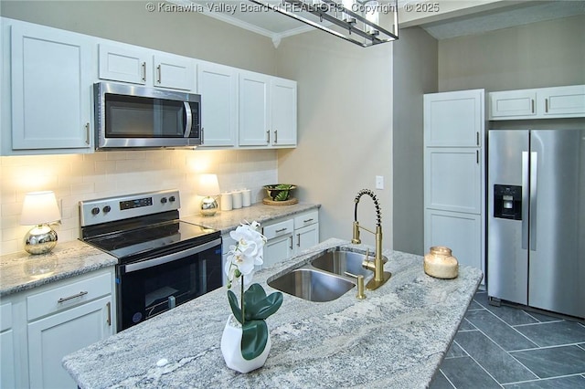 1505 Lee St E, Charleston, WV 25311 - kitchen with appliances with stainless steel finishes, a sink, ornamental molding, decorative backsplash, and white cabinetry