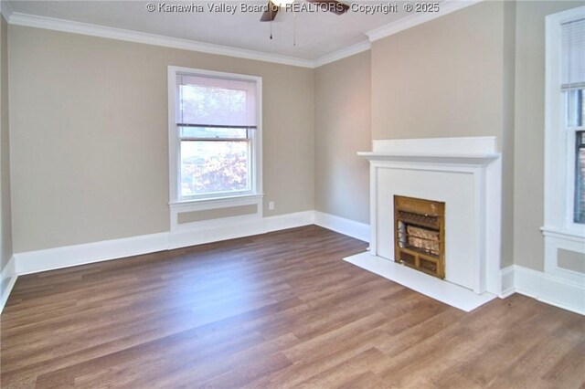 1505 Lee St E, Charleston, WV 25311 - unfurnished living room with crown molding, wood finished floors, a fireplace with flush hearth, a ceiling fan, and baseboards