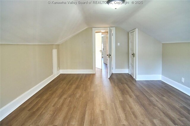 1505 Lee St E, Charleston, WV 25311 - bonus room featuring wood finished floors, vaulted ceiling, and baseboards