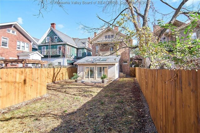 1505 Lee St E, Charleston, WV 25311 - back of property with a fenced backyard and a chimney
