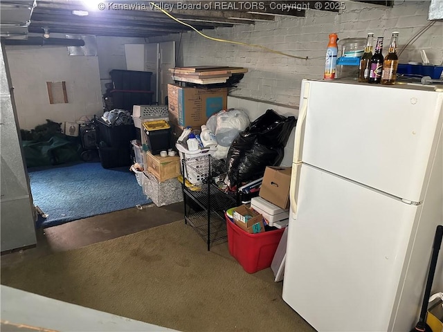 5505 Washington Ave, Charleston, WV 25304 - unfinished below grade area with freestanding refrigerator and concrete block wall