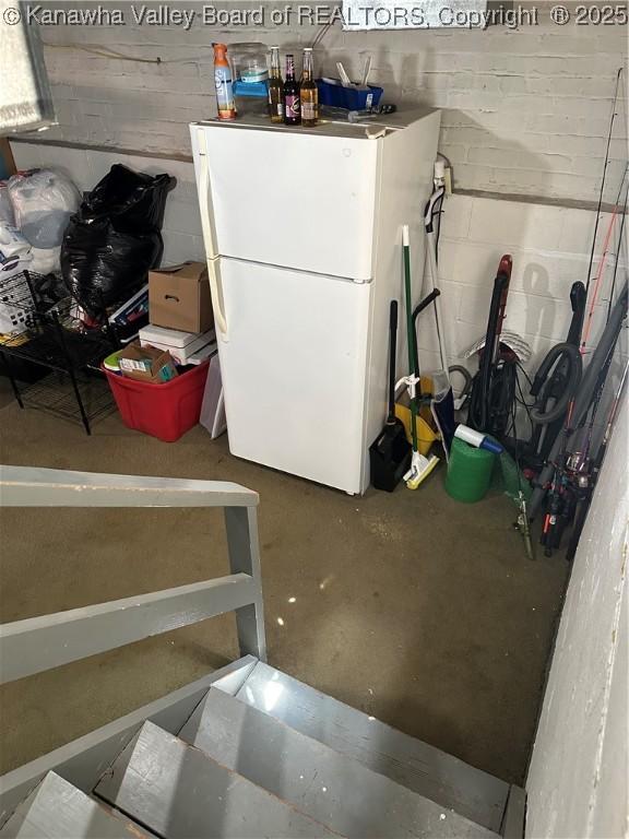 5505 Washington Ave, Charleston, WV 25304 - below grade area featuring freestanding refrigerator and concrete block wall