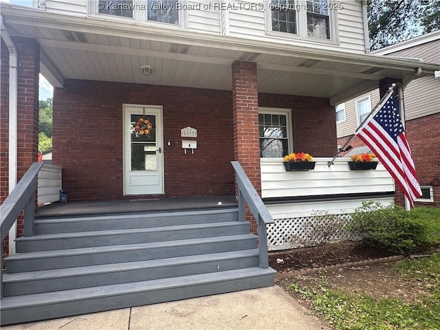 5505 Washington Ave, Charleston, WV 25304 - doorway to property with covered porch and brick siding