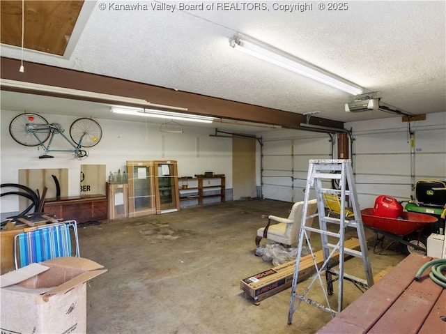 garage featuring a garage door opener