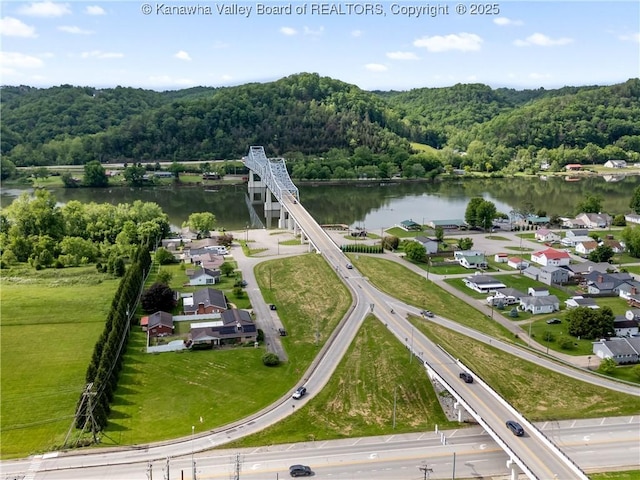 aerial view of a heavily wooded area and a large body of water