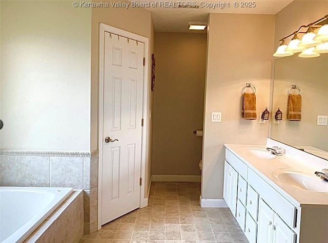 full bath with a bath, double vanity, baseboards, and toilet
