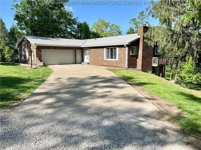 486 Woodland Acres Dr, Ripley, WV 25271 - ranch-style home featuring concrete driveway, a garage, a front yard, a chimney, and brick siding