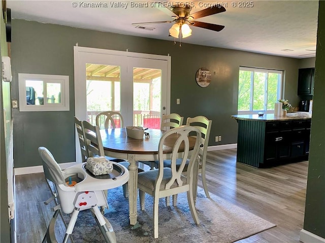 486 Woodland Acres Dr, Ripley, WV 25271 - dining area featuring ceiling fan, light wood-style flooring, and baseboards